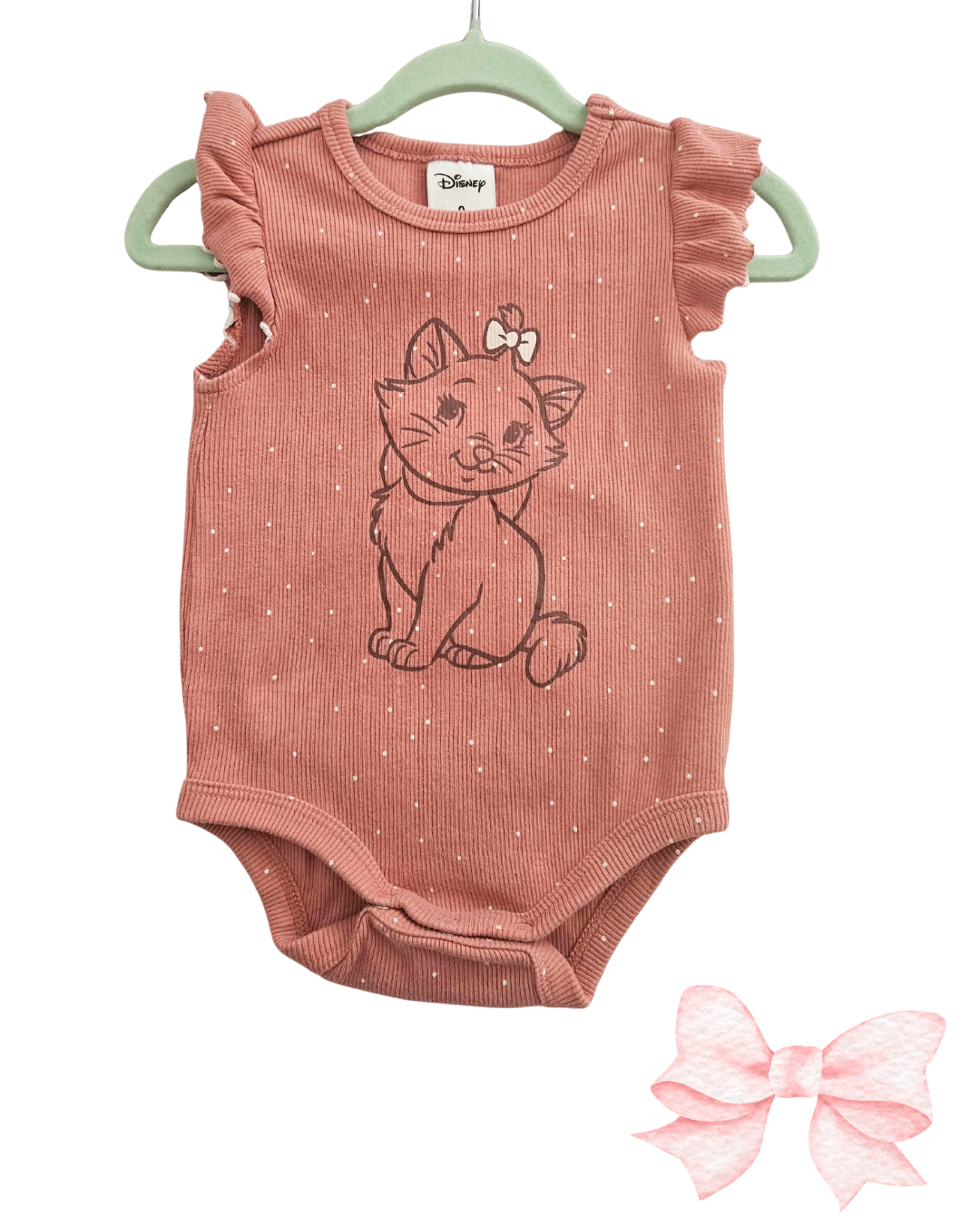 Pink baby bodysuit with cat design and matching headband on a white background