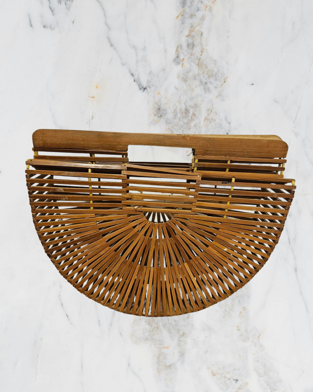Wooden handbag on a marble background